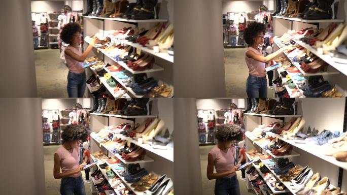 一名女子在一家鞋店使用平板电脑查看存货