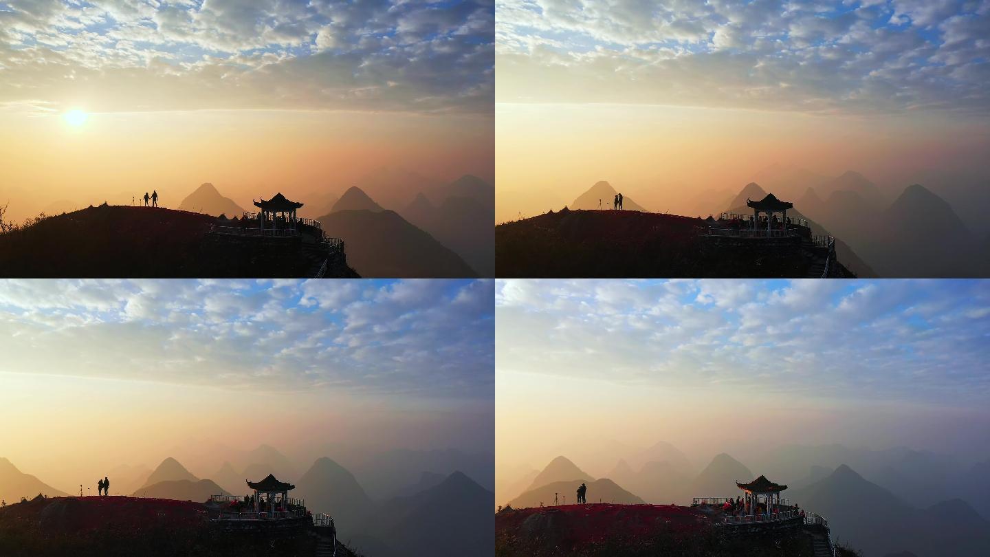 航拍情侣在山顶爬山看日出的浪漫画面