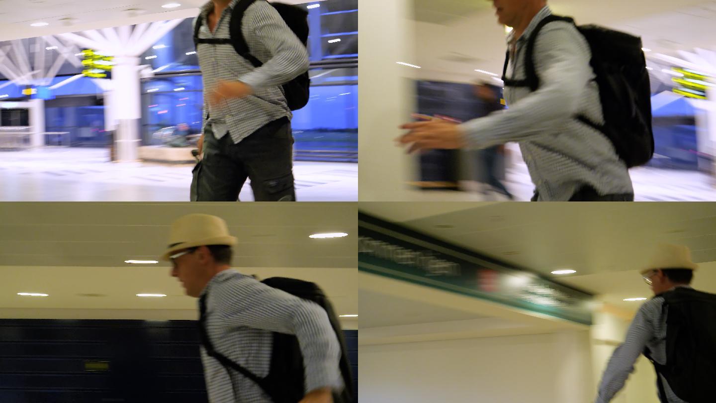 紧张的男子带着手提箱和背包在机场跑向登机口