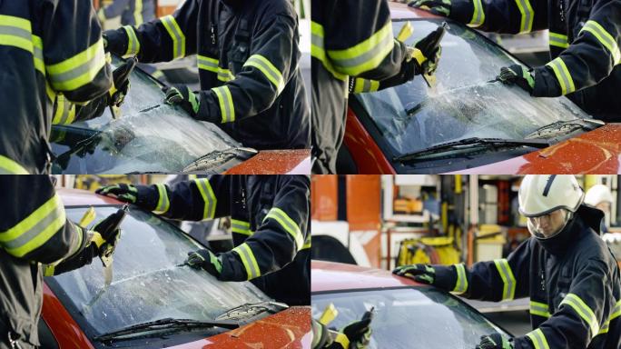 两名消防员正在切割一辆汽车的挡风玻璃
