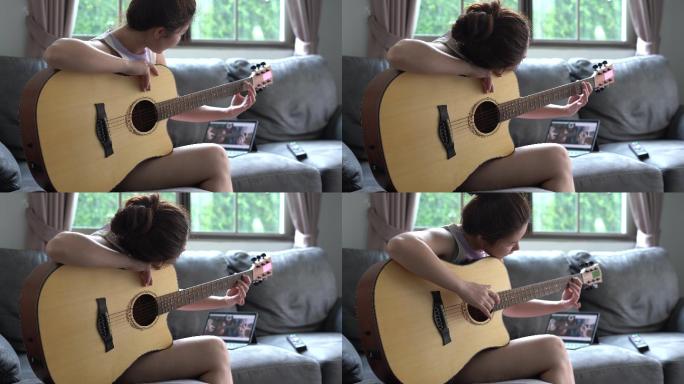 女人在家学习弹吉他