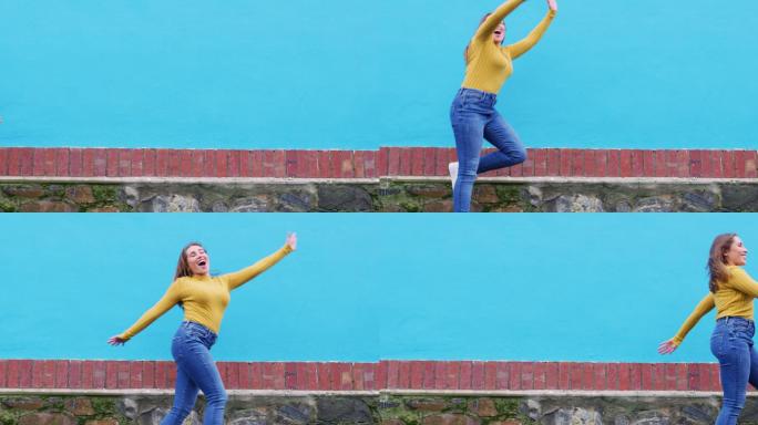 一名年轻女子在蓝色背景下跳跃的照片