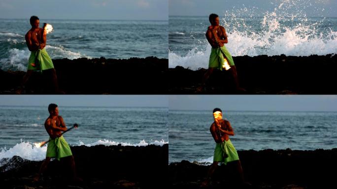 夏威夷火刀舞者在海边表演，慢动作
