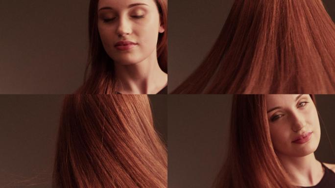 美丽的红发女孩甩着她的长发