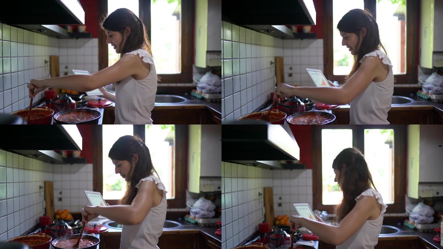 年轻女子在厨房烹饪酱汁