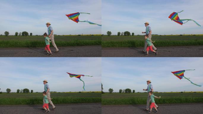 爷爷和小男孩在乡下玩风筝