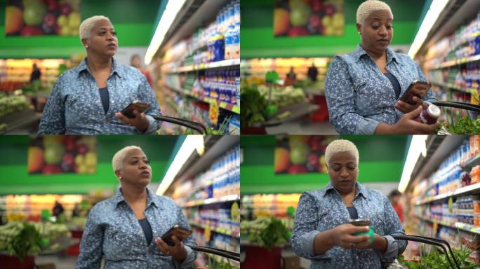 妇女在超市用手机购物