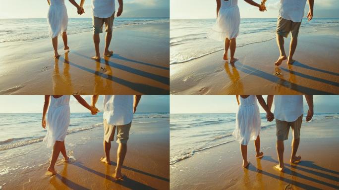 情侣享受沙滩漫步新婚之旅浪漫情侣脚印足迹