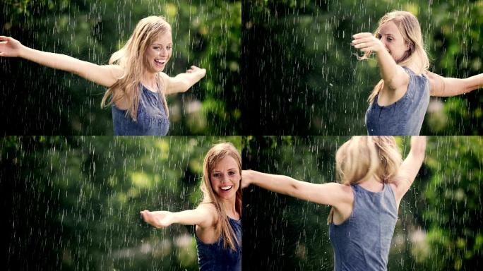 一个女人站在外面的夏雨中