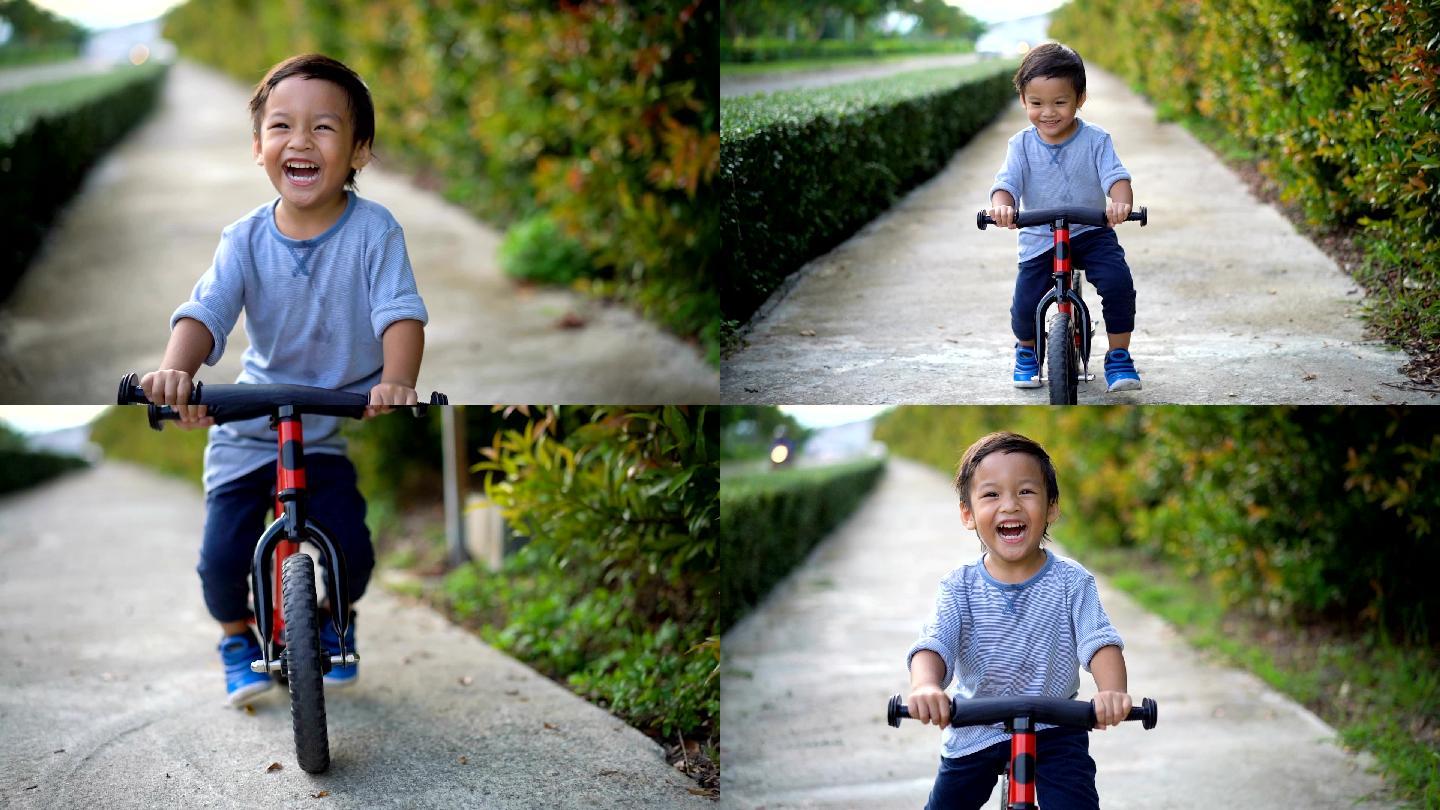 幼儿在骑自行车。小孩子玩乐亲子