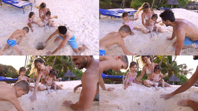 快乐的一家人在沙滩上玩耍。