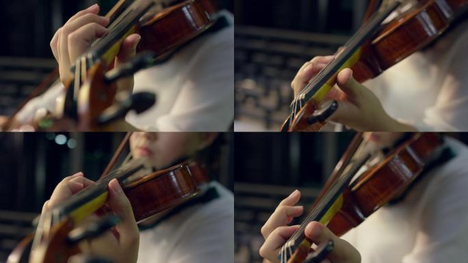 女孩拉小提琴演奏特写