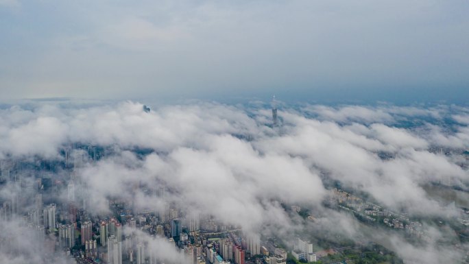 航拍广州珠江新城上空白云飘荡的壮观情景