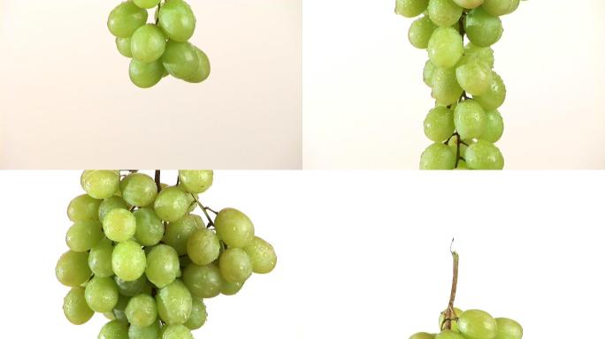 一束葡萄在白色背景上缓慢旋转
