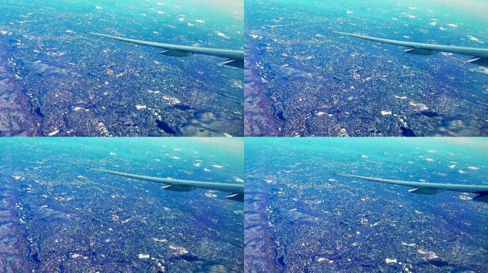 城市鸟瞰图俯瞰客机蓝色星球