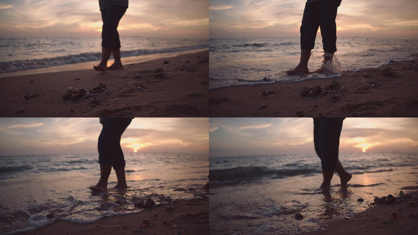 在海边散步的男人赤脚光脚黄昏晚霞傍晚漫步