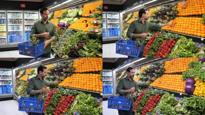 男人在超市买水果男人逛超市买橘子大卖场