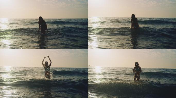 在海里溅水的女人玩水欢乐