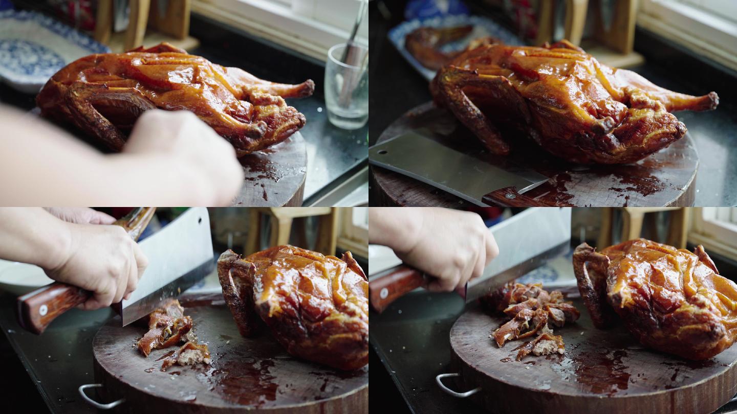 一位厨师在斩切一整只美味的广式烧鸭