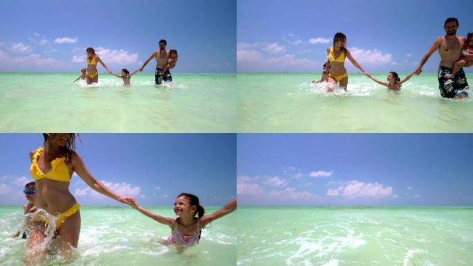 无忧无虑的一家人在海上奔跑时玩得很开心。