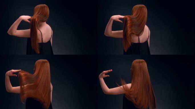 一位迷人的红发女子甩着健康的长发