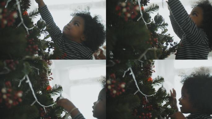 小女孩在家玩圣诞树