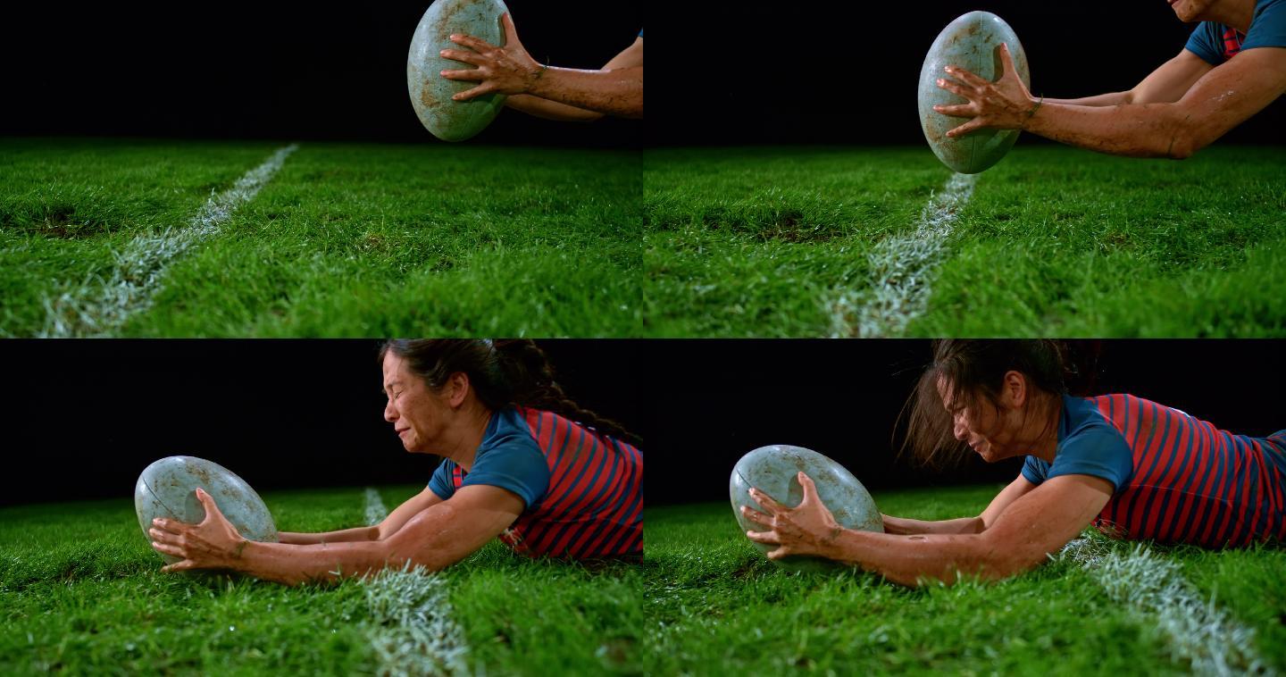 女子橄榄球运动员摔倒在地，将球接地并得分