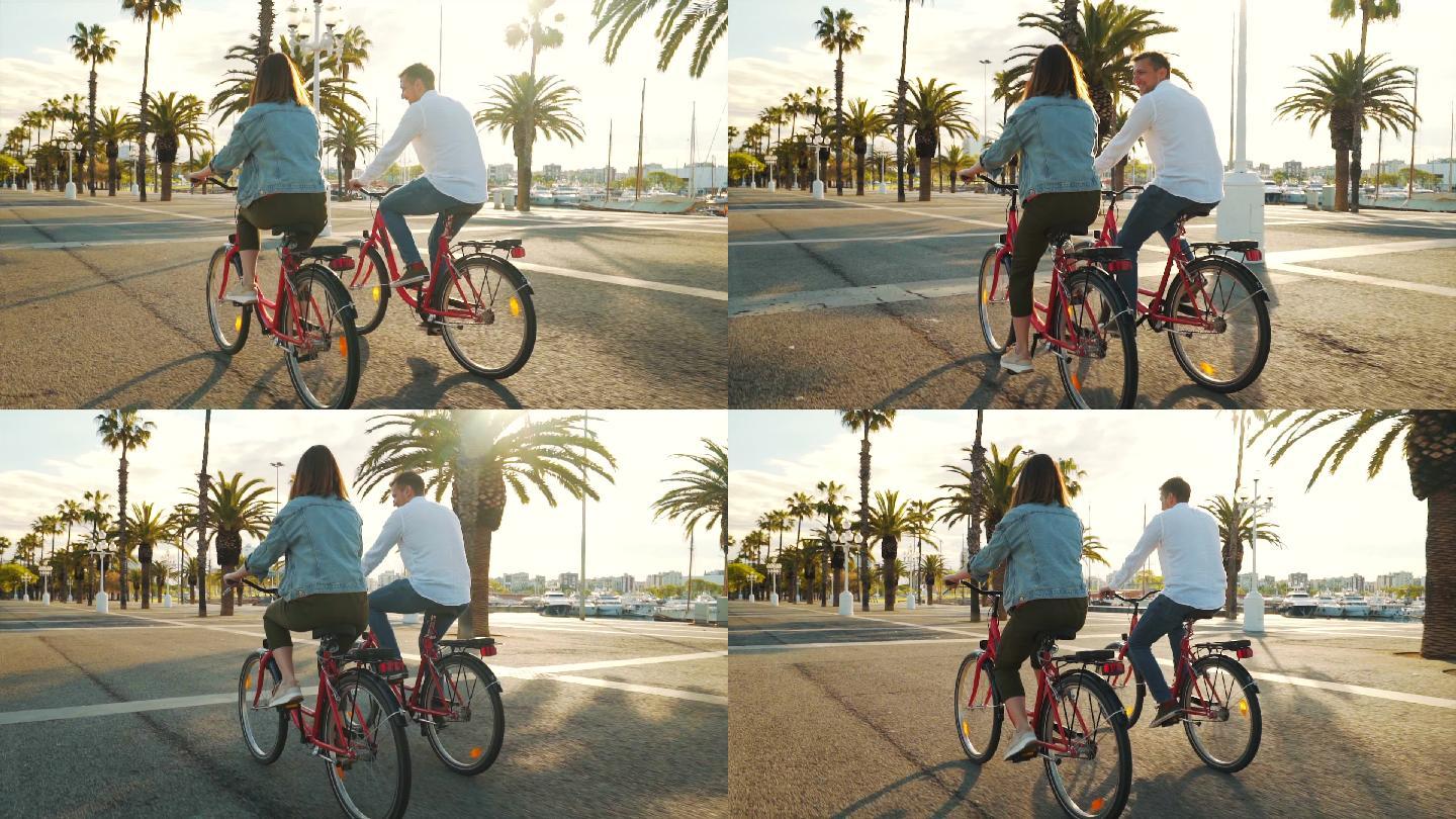年轻夫妇骑自行车欣赏城市景色