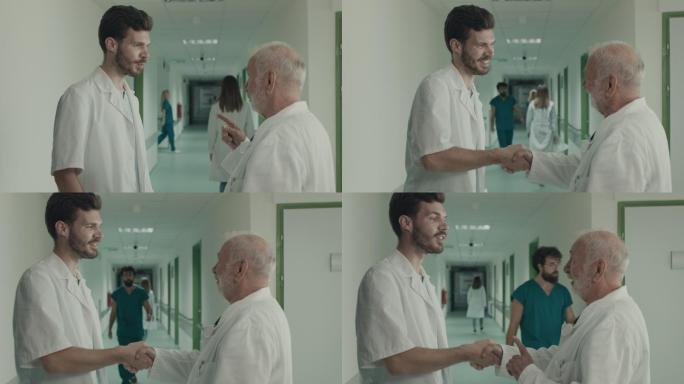 两名医生在医院交谈和握手