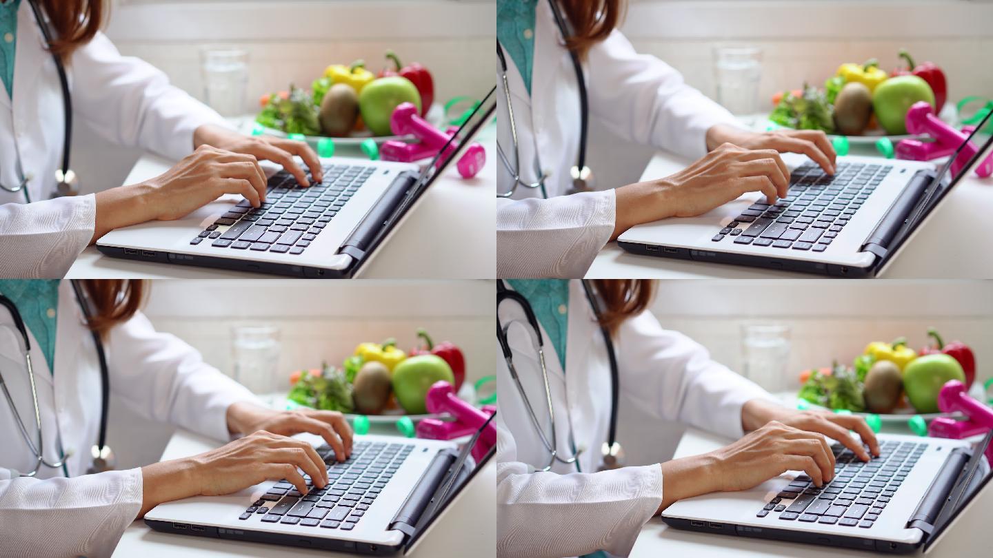 营养师使用笔记本电脑为患者提供建议