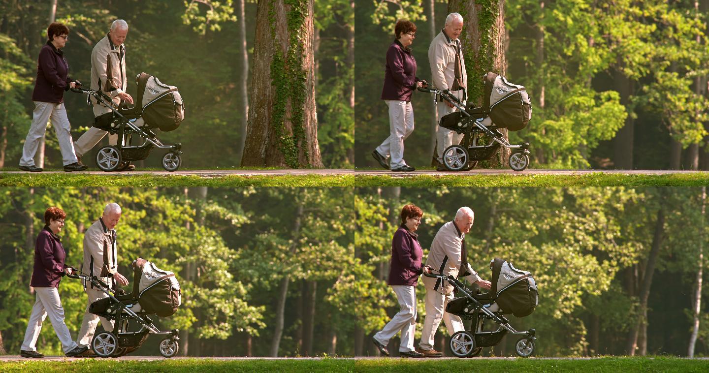 祖父母推着孙子在公园散步
