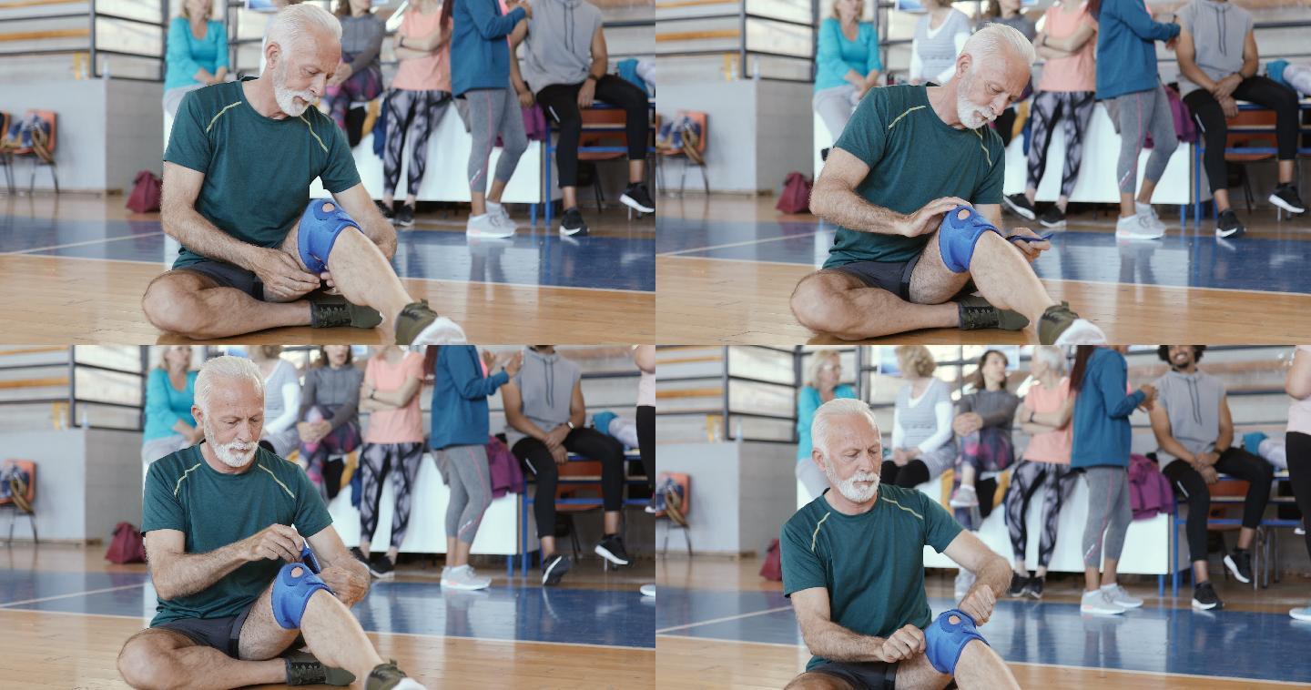 老人将护膝垫放在受伤的膝盖上