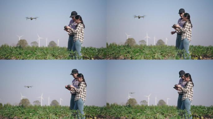 两个农民使用无人机在农民智能农场一起工作