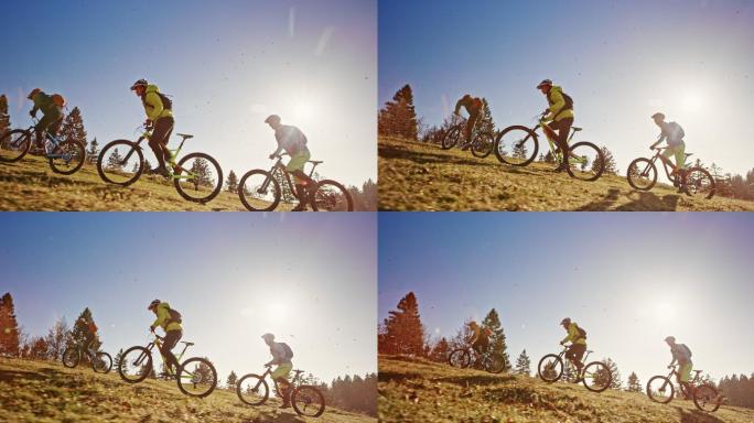 山地自行车骑行在阳光明媚的山地草地上