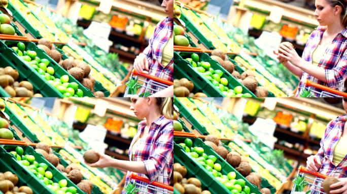 在超市挑选水果的女人。