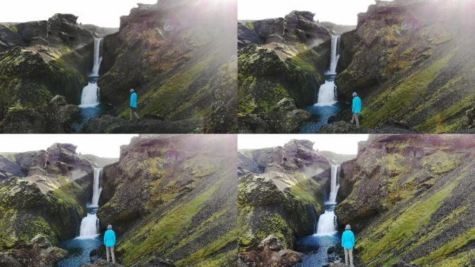 冰岛瀑布附近的女性风景鸟瞰图