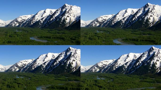 阿拉斯加森林溪流和雪山的空中拍摄