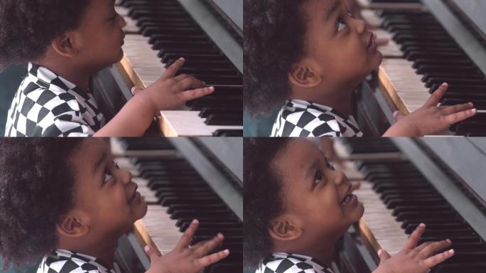 弹钢琴的小男孩练习童年男孩