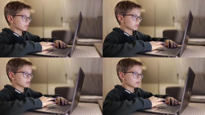 小男孩在家里使用笔记本电脑