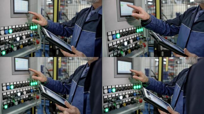 男性员工使用工厂机器上的触摸屏输入数据