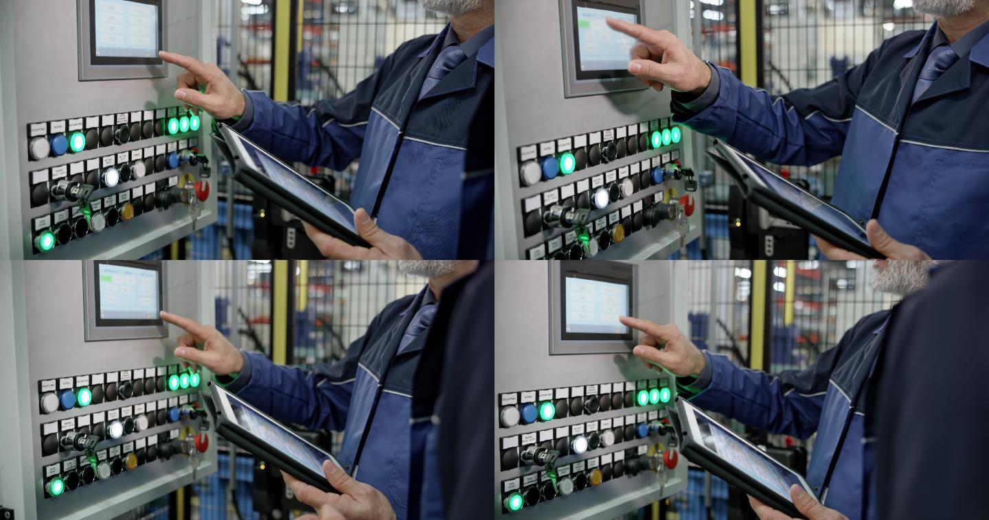 男性员工使用工厂机器上的触摸屏输入数据