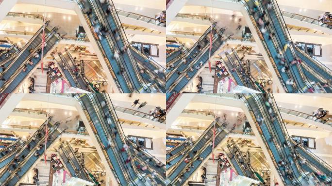现代购物中心拥挤的使用自动扶梯的人