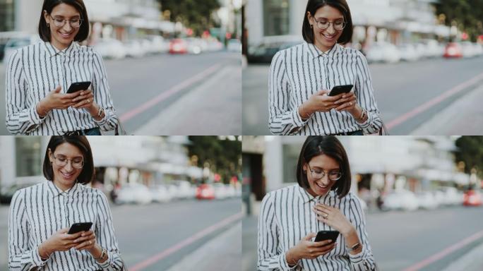 女子在城市街头使用手机