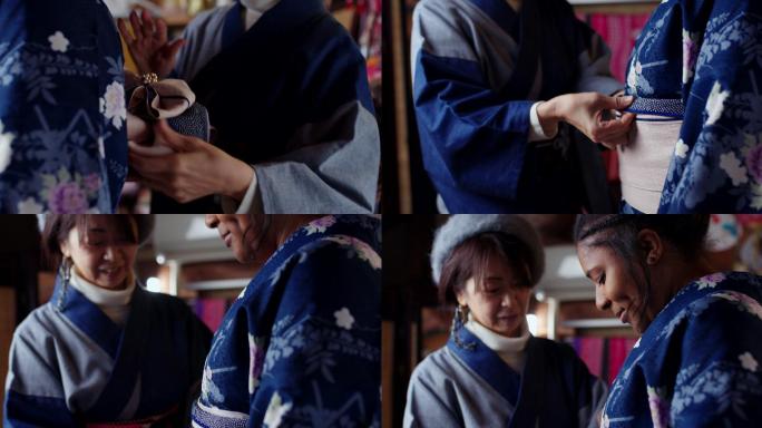 一名日本妇女在游客和服上调整Obi的特写镜头