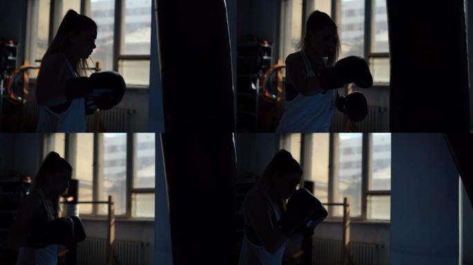 美女在健身房里打拳击。
