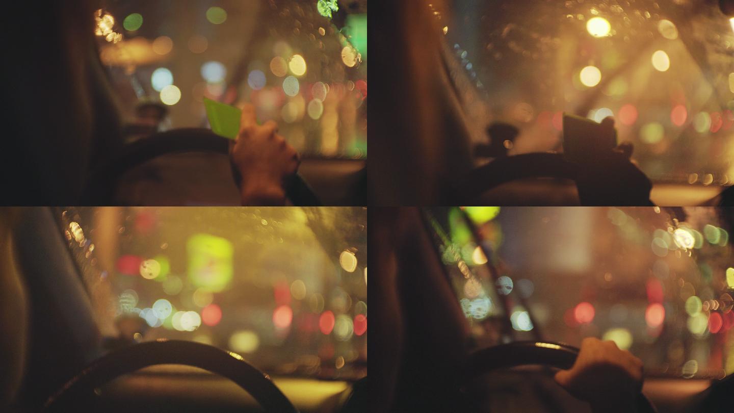 晚上在雨中开车的女人的肩上镜头