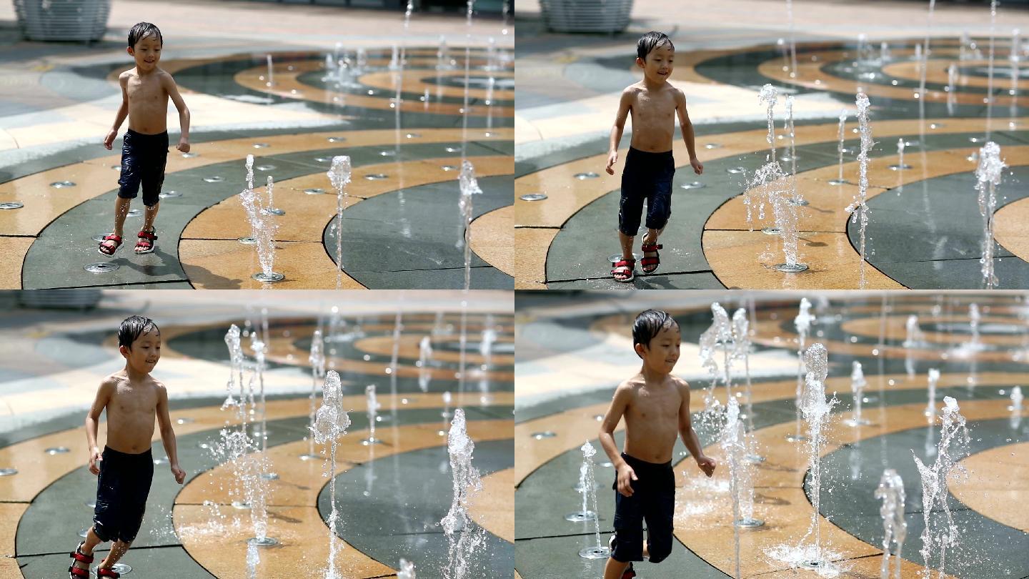男孩通过喷泉玩耍升格视频素材夏日开心笑容
