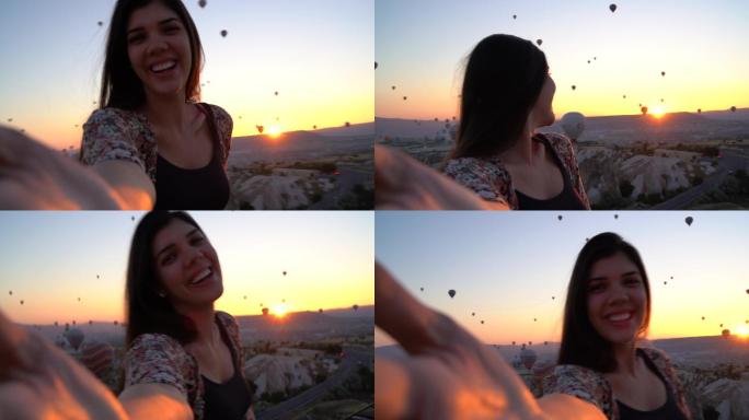 游客自拍热气球飞行山脉夕阳日出日落
