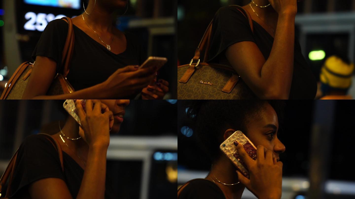 妇女在城市街头使用手机