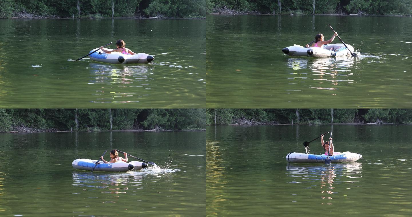 在湖边，年轻的女孩划着橡皮艇